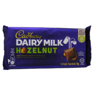 A bar of Cadbury Dairy Milk chocolate with whole hazelnuts embedded on the front.