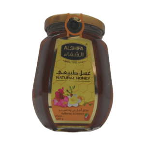 A jar of Al Shifa Honey 500g, featuring vibrant packaging with the Al Shifa logo and honeycomb illustrations.